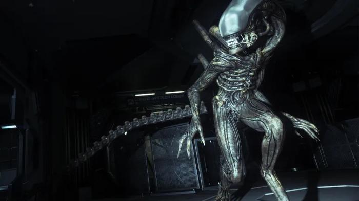 aaa alien game a xenomorph stalks a darkly lit area.
