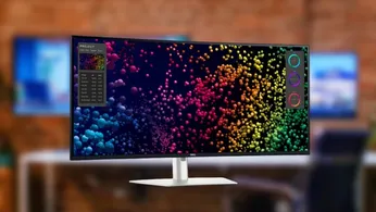 Dell's new Ultrawide 5K monitor in front of a blurred image