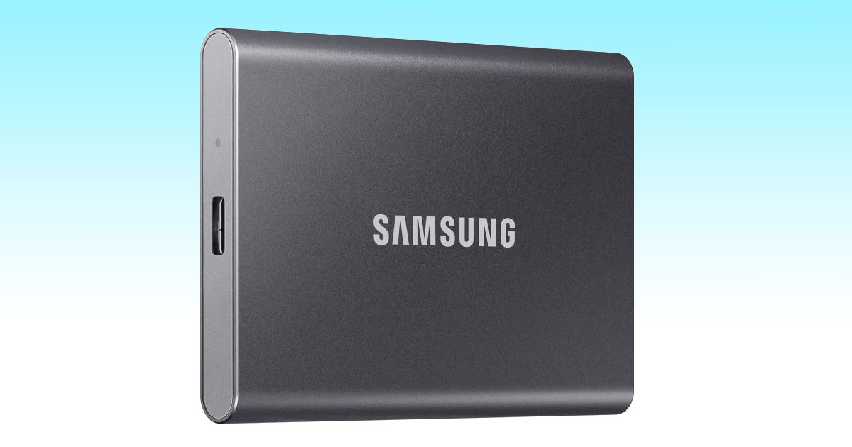 A dark grey external SSD featuring grey Samsung branding on the front.