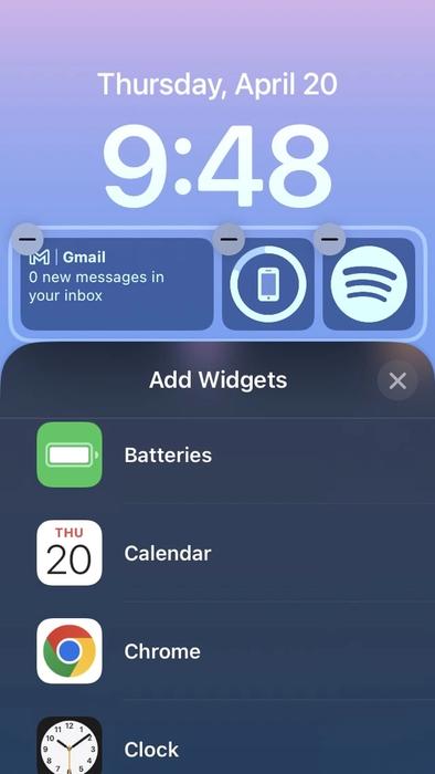 A screenshot of the iPhone lockscreen in editing mode for widgets.
