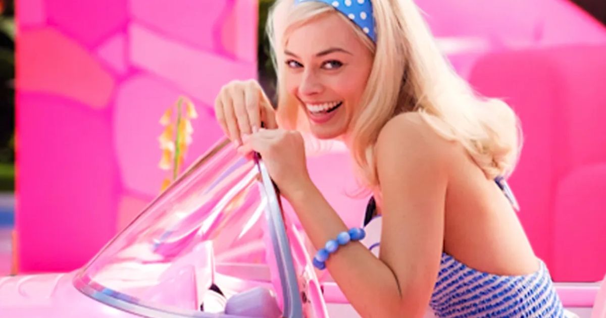 Forza Horizon 5 Barbie Crossover - Margot Robbie smiling in a 1956 Corvette EV
