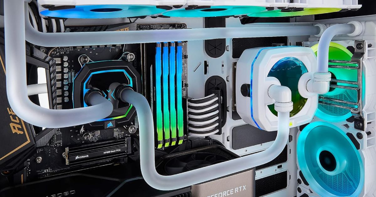 The inside of a PC featuring blue and green lighting and tubes of clear cooling fluid.