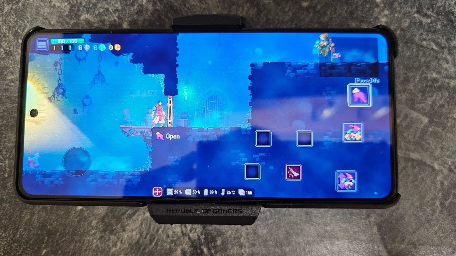 ASUS ROG Phone 8 Pro with Dead Cells playing on the screen