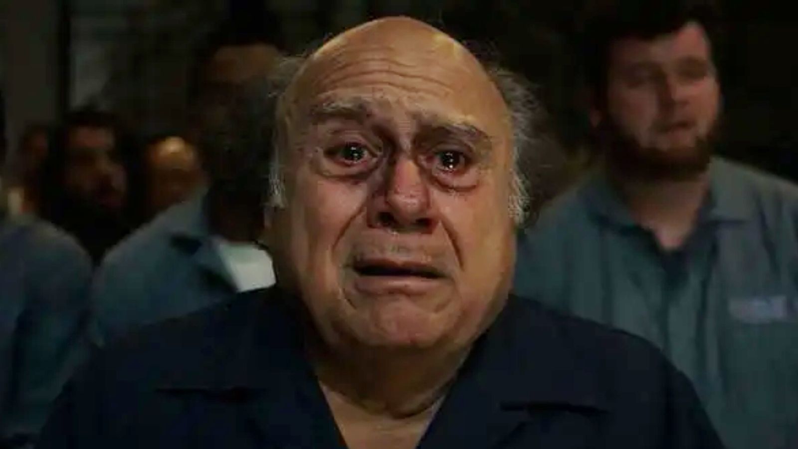 Danny DeVito with a very beaten up face having an epiphany 