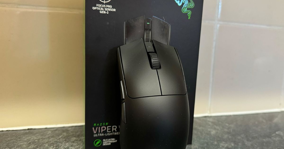 Razer Viper V3 Pro in front of the box and a tiled wall