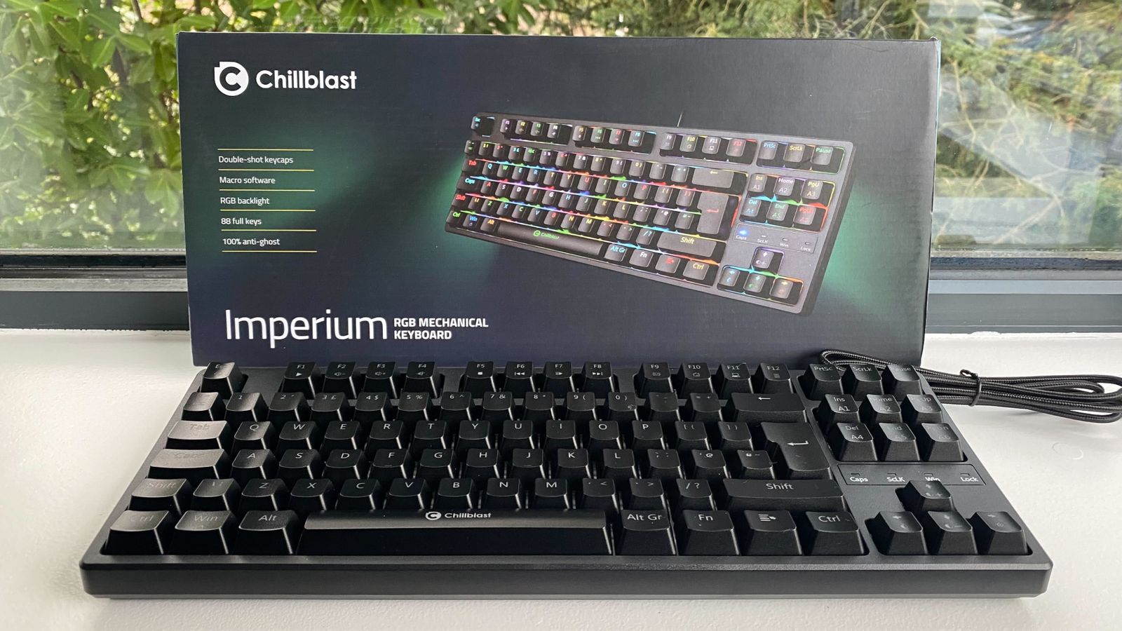 A black keyboard in front of a box.