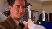 Dale Cooper’s iconic thumbs up on top of an image of the Twin Peaks PS1 game 