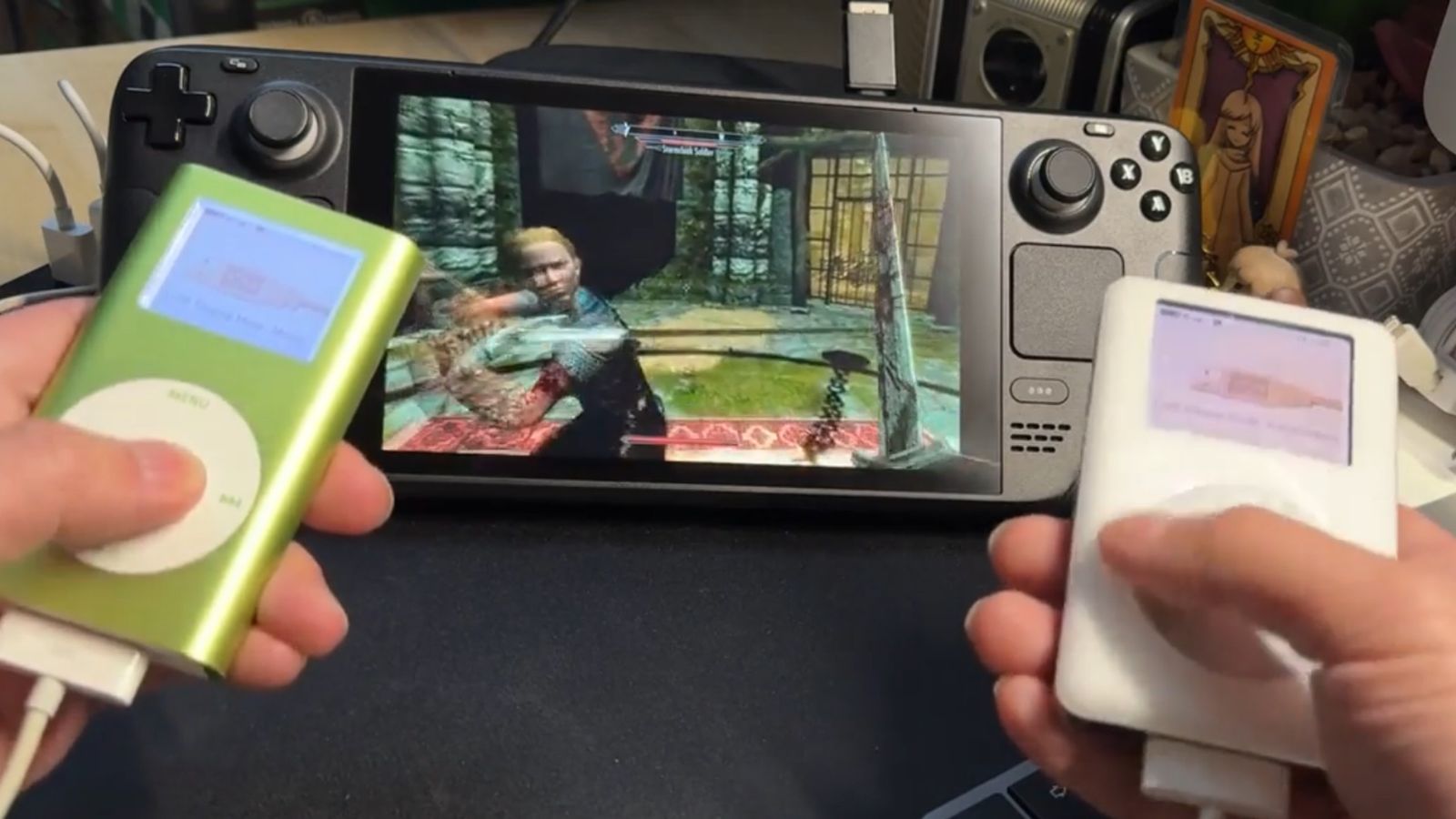 A PoV shot of someone playing Skyrim on a Steam Deck using two iPods as controllers 