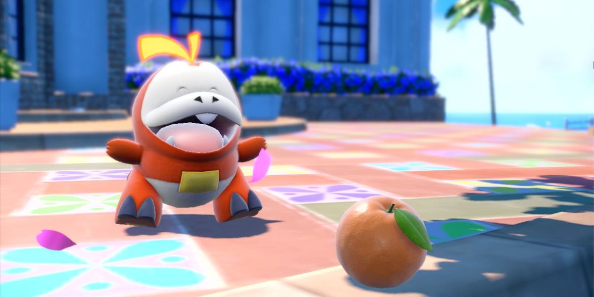 Pokémon Scarlet and Violet gen 9 leaks: fire starter Fuecoco looking at an apple 