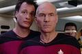 Jean-Luc Picard and Q standing on the bridge of the Starship Enterprise