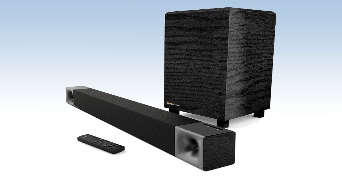 A black and grey rectangular soundbar with a subwoofer and remote in front of a white and blue gradient backdrop.