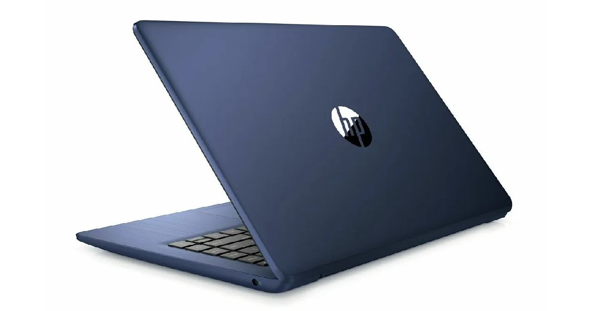 A dark blue laptop half open with its black keyboard just visible.