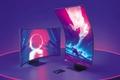 Two monitors, one horizontal and one vertical, on top of a purple plinth with pink lighting around the edge.