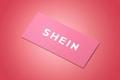 a pink business card with the word shein written on it .
