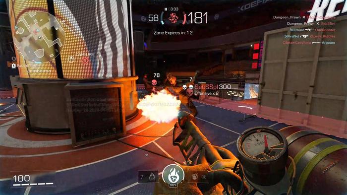 First-person gameplay of XDefiant: A Ubisoft Original using a flamethrower against two enemies.