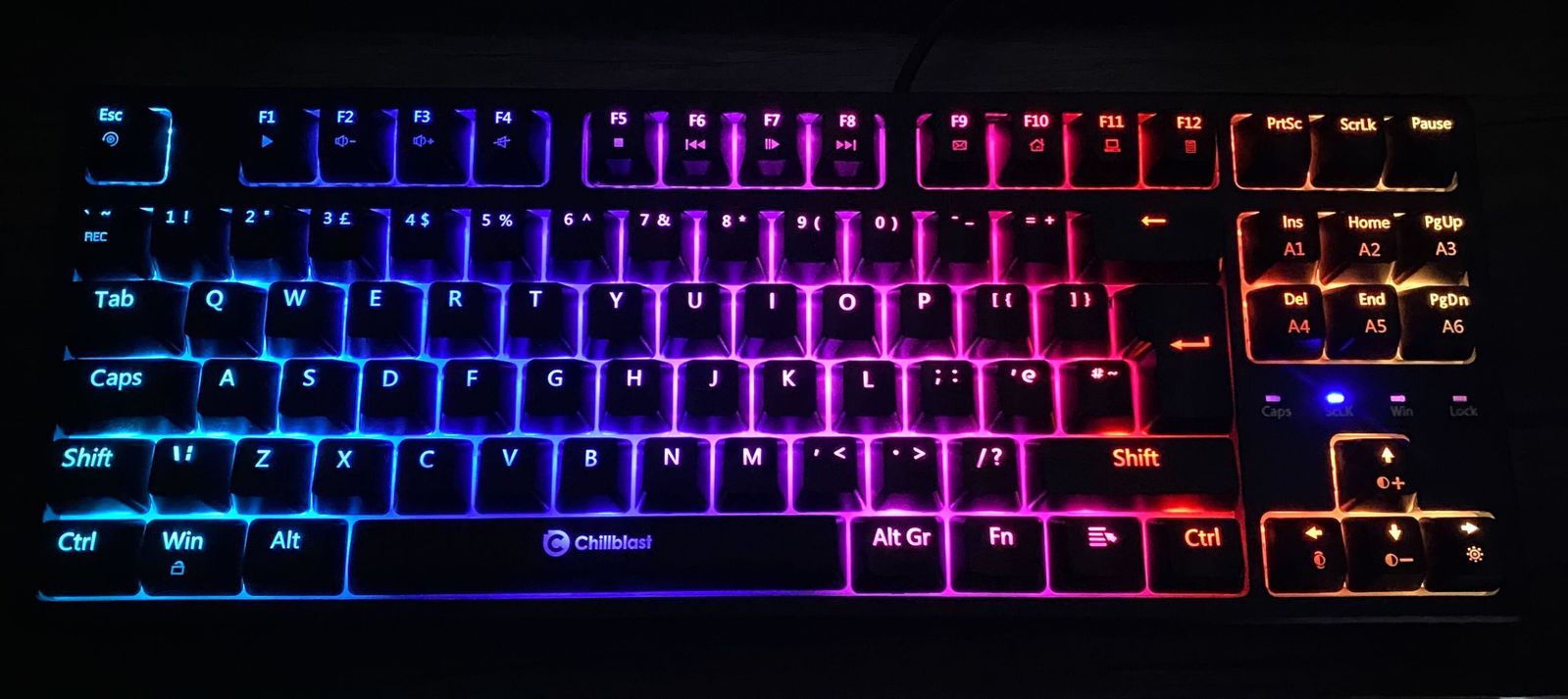 Image of the Chillblast Imperium with backlit keys turned on to display the multiple colours, including blue, pink, and orange.