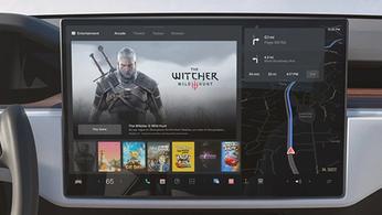 Computer screen showing gaming icons like The Witcher in a Tesla car
