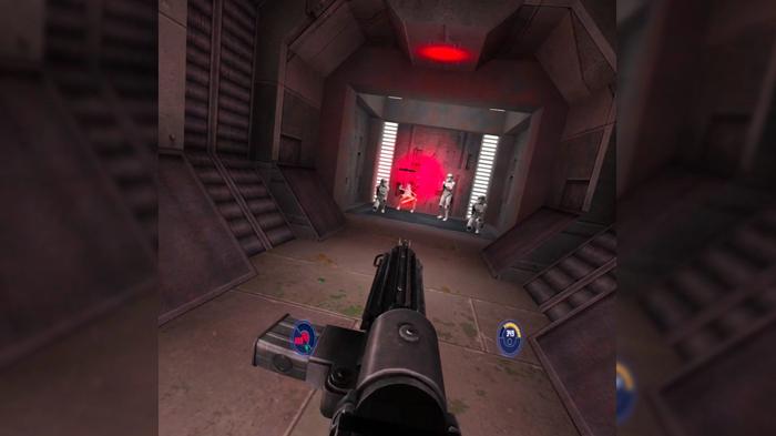 First person gameplay of Jedi Outcast VR showing blaster gameplay against a squad of stormtroopers in an elevator