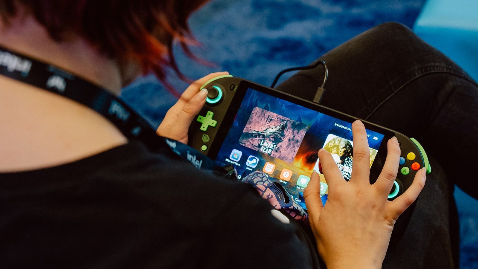 Tulpar's upcoming handheld gaming PC being used by an IEM 2024 attendee