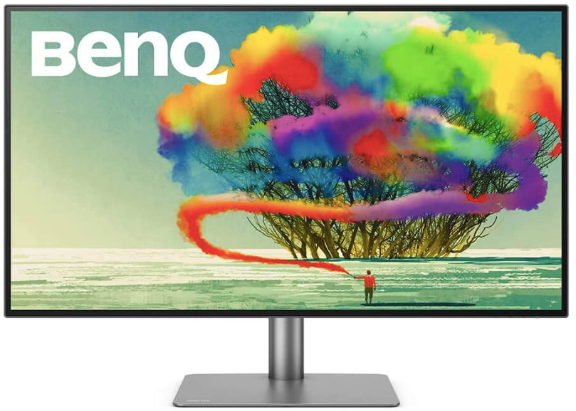 BenQ PD3220U product image of a black and grey monitor with an image of someone spraying multiple colours into a tree on the display.