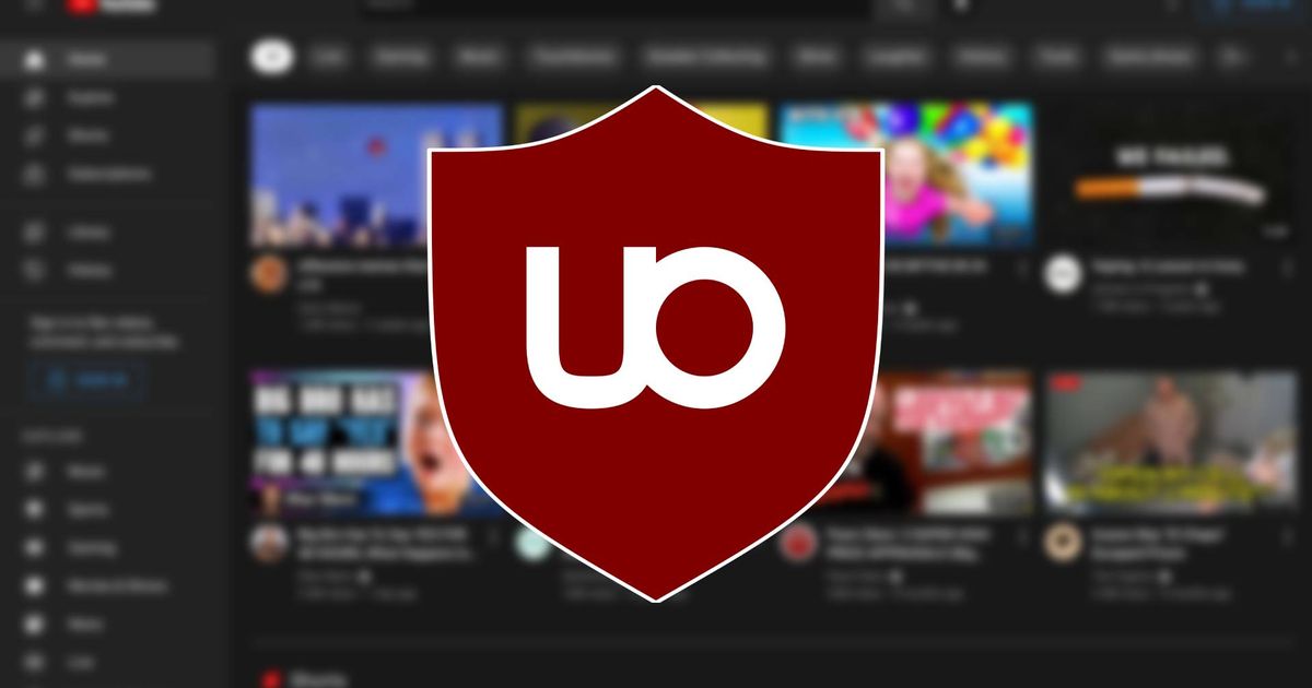 An image of the uBlock logo in the background of YouTube's home screen