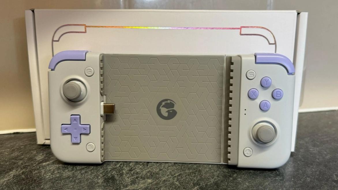 Gamesir X2s in front of the box and a tiled wall