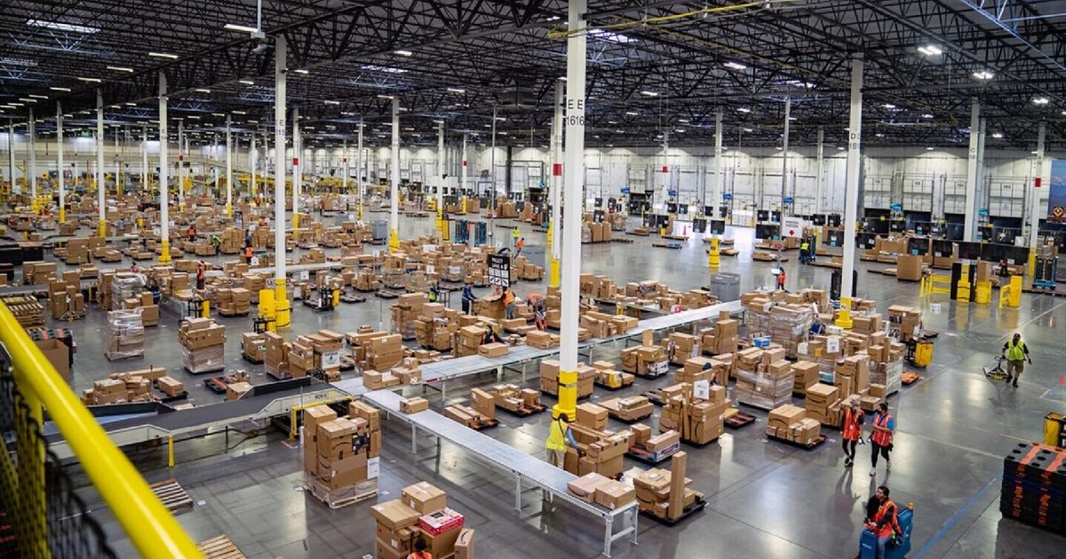 Amazon is laying off record-breaking numbers of workers an amazon warehouse