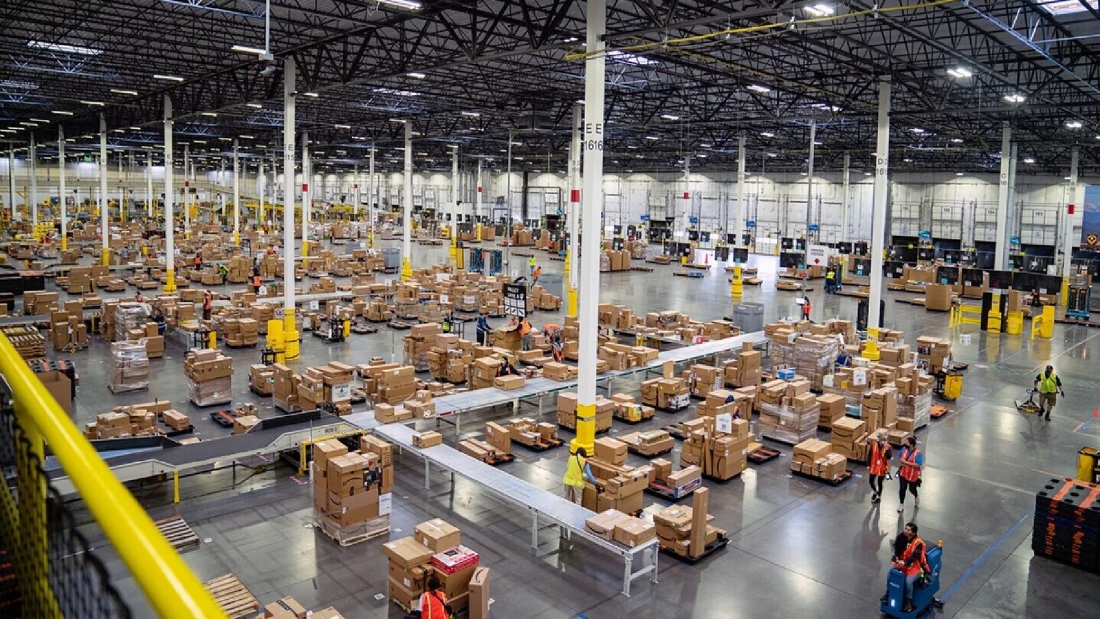 Amazon is laying off record-breaking numbers of workers an amazon warehouse