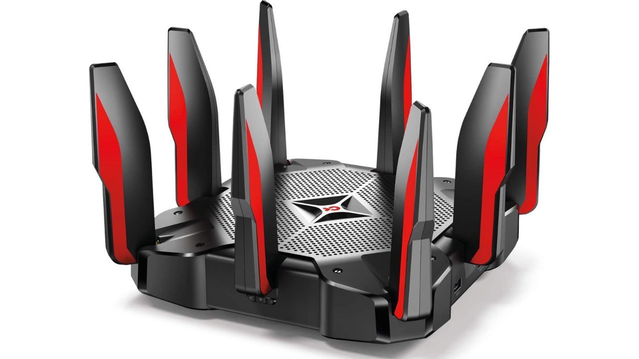 TP-Link Archer C5400X product image of a black router with red trim on the antenna.