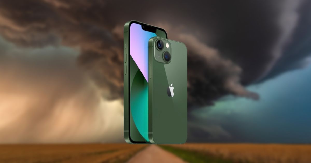An image of an iPhone and a tornado forming in the background - turn on weather alerts