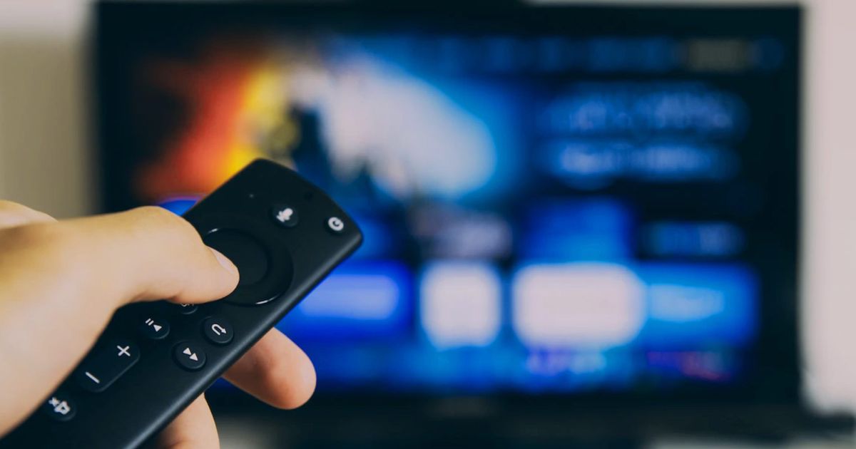 A person using an Amazon Fire TV device 