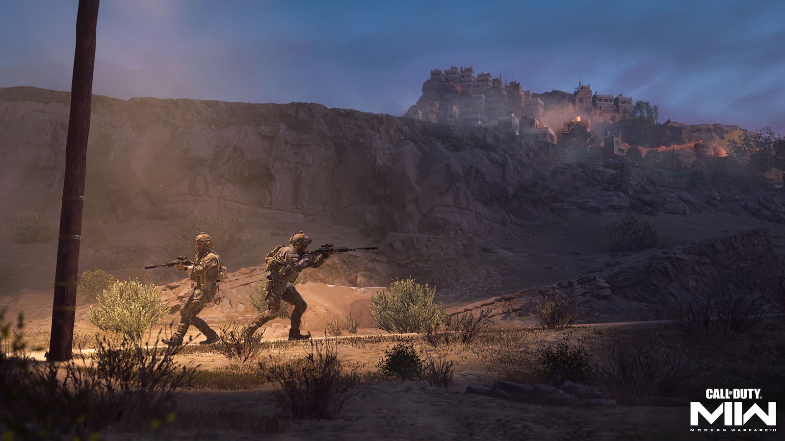 Two soldiers under a street light in a desert. On a hill above them is a settlement - Modern Warfare 2 won't download