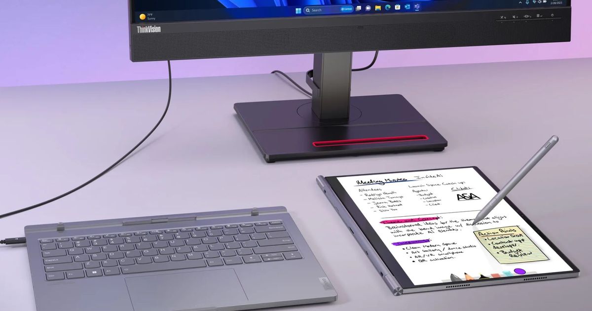 The Lenovo ThinkBook Plus Gen 5 Hybrid laptop mode plugged into a keyboard and Android mode being used as a notepad