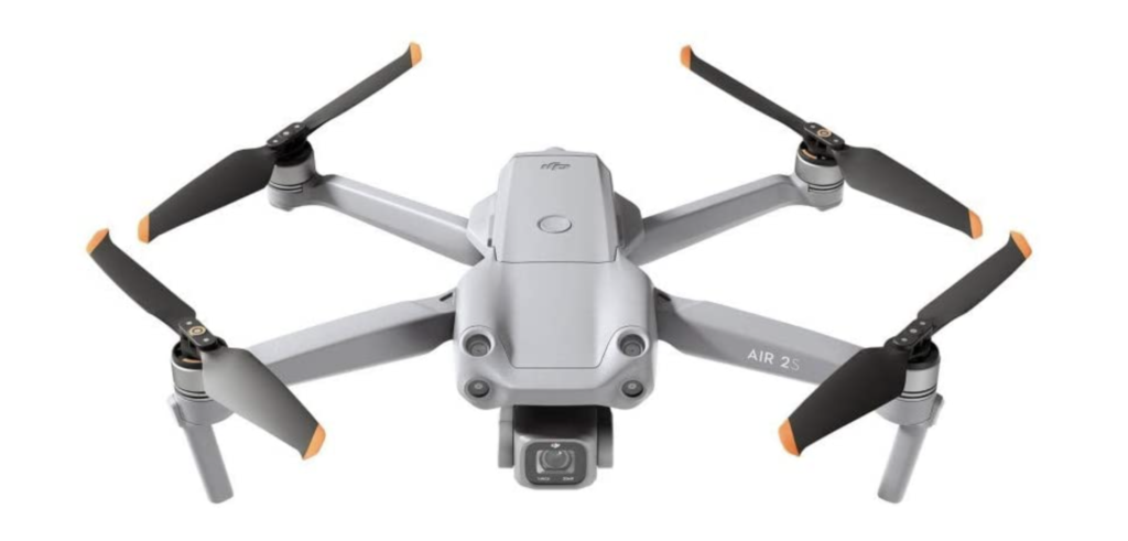 DJI Air 2S product image of a light grey drone with for darker grey propellers.