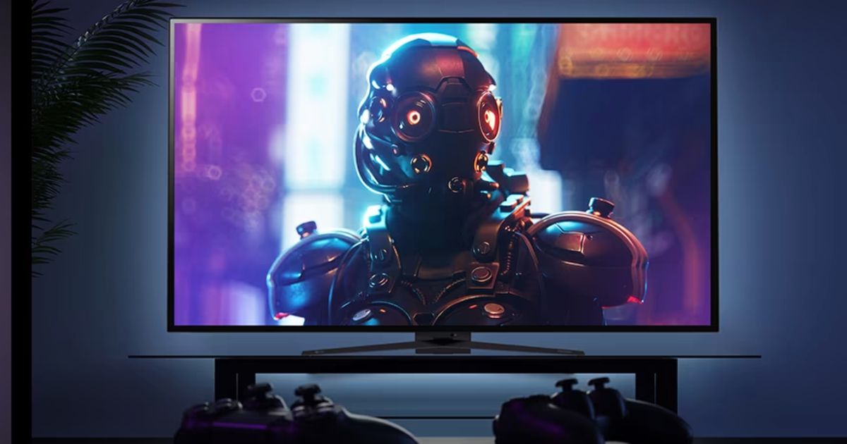 Image of two black controllers in front of black monitor featuring a robot on the display.