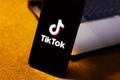 how to fix tiktok server error a phone with the tiktok logo on it