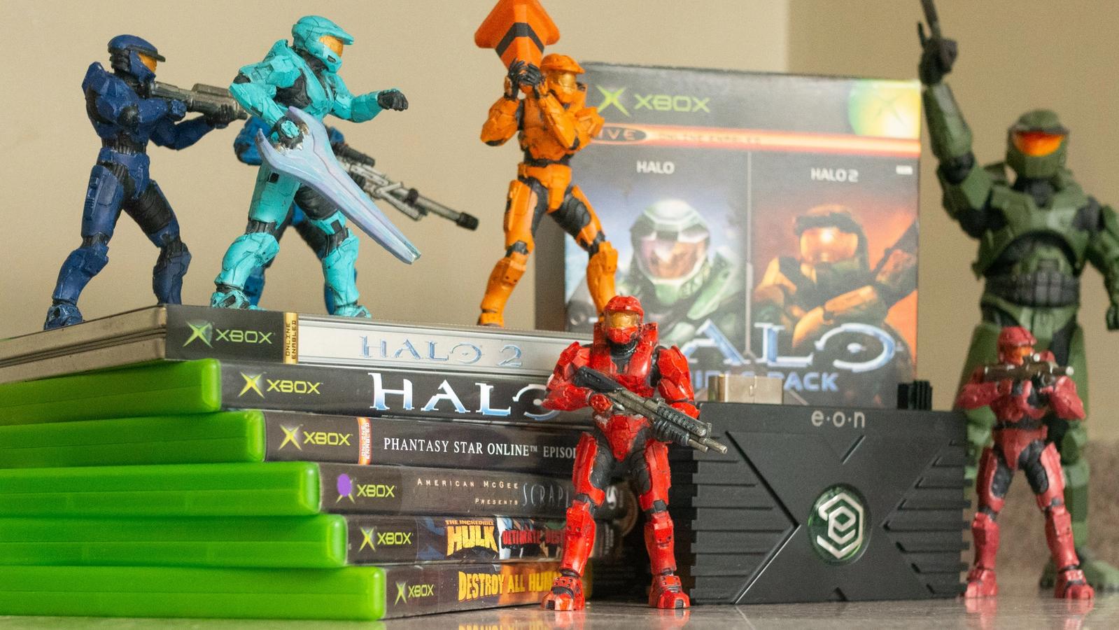 The EON Gaming XBHD adapter between a myriad of OG Xbox games and a collection of Red vs Blue Halo spartan figurines