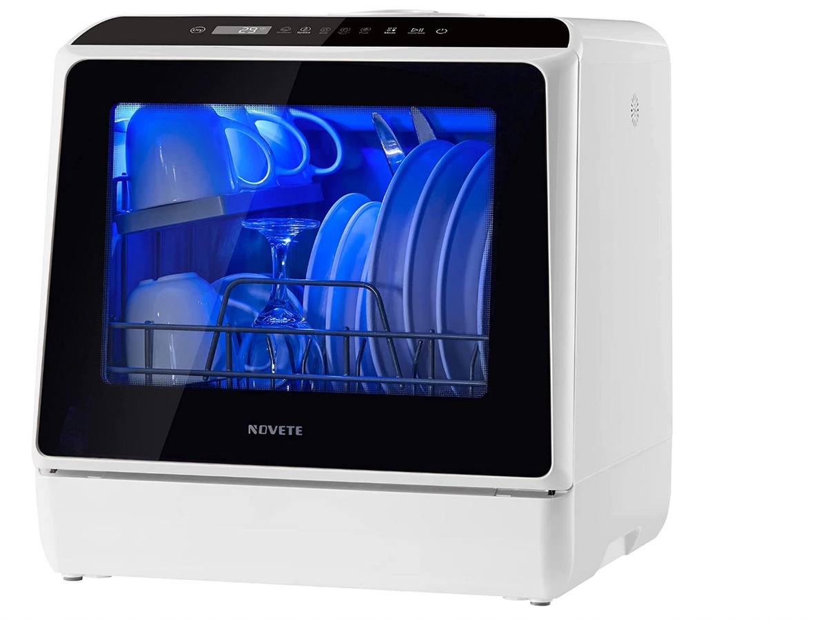 NOVETE product image of a white countertop dishwasher with a blue light inside.