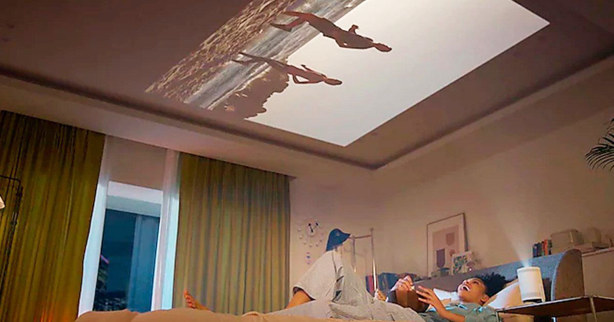 New Samsung projector woman gaming on the ceiling