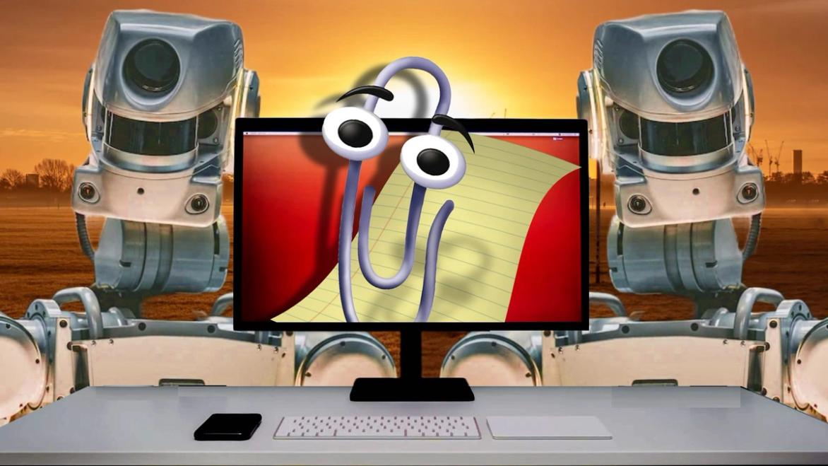 Clippy is the new face of AI - Clippy on a monitor next to two robots in the post apocalypse 