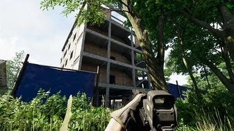A first-person screenshot of the player looking at a large building under construction in Gray Zone Warfare, with a rifle at the ready as they peek through the trees.