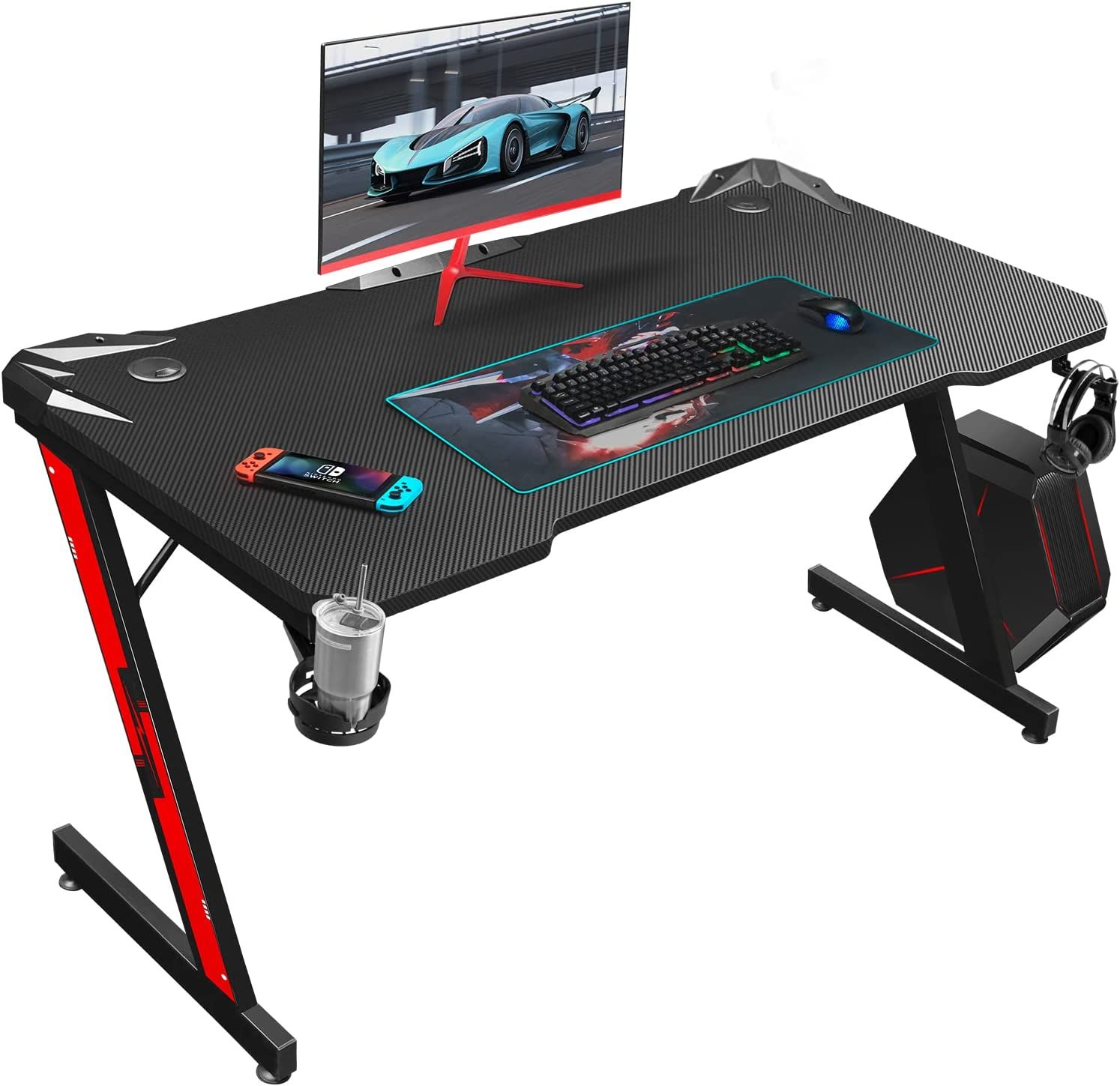 Homall Gaming Desk product image of a dark grey and red gaming desk with a monitor, keyboard, and mouse sat on top.