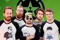 The achievement hunter group standing together on a background of their logo