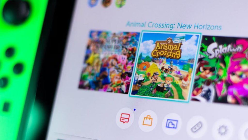 Green nintendo Switch on home menu, featuring Animal Crossing and Super Smash Brothers