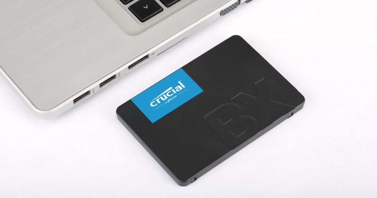 A black, rectangular-shaped SSD featuring a blue label with white Crucial branding on top.