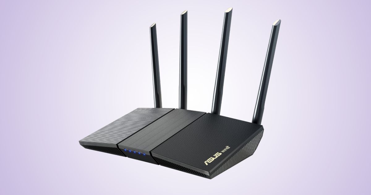 A black WiFi router with five small blue lights on the front and four antennae sticking out the back