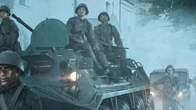 Soldiers sitting on a tank as they proceed through a town.