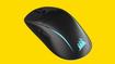 Corsair M75 Wireless mouse in front of a bright yellow background