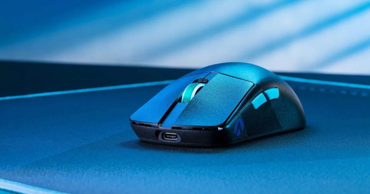 Image of a black, wireless ASUS mouse on a mousepad in a blue lit room.