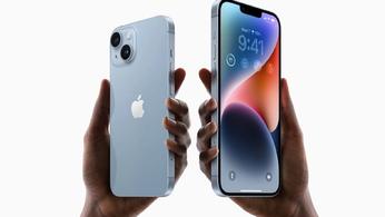 Two hands holding up the iPhone 14 and Plus models in press image